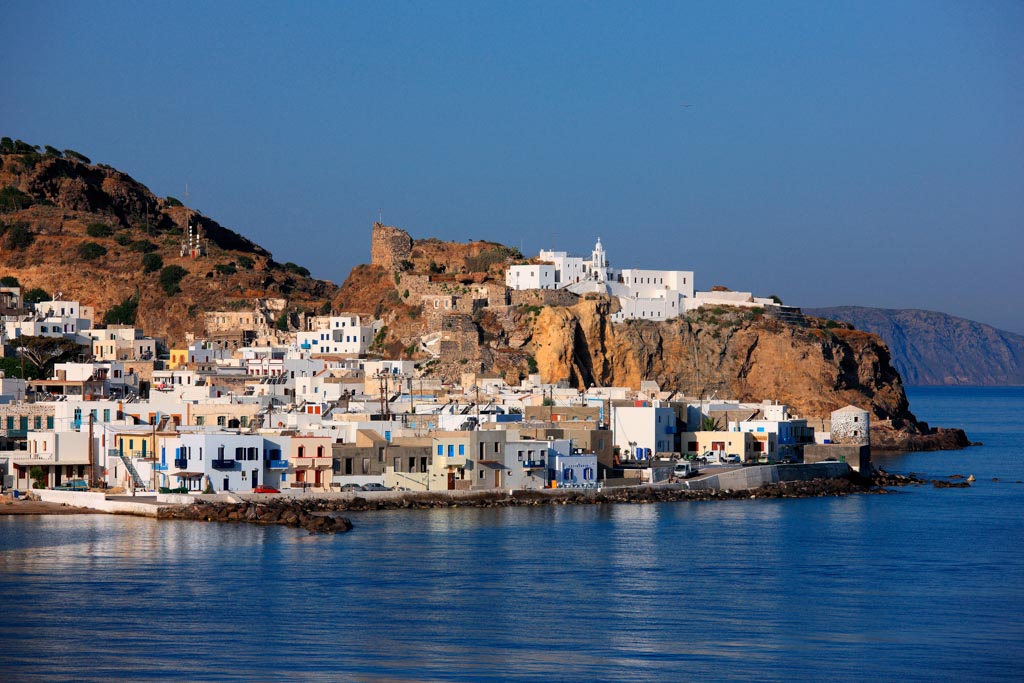 NISYROS ISLAND, DODECANESE, GREECE- June 13, 2008. View of Mandraki, capital village and main port of the island. On the rock above the village you can see the Monastery of Panagia Spiliani.